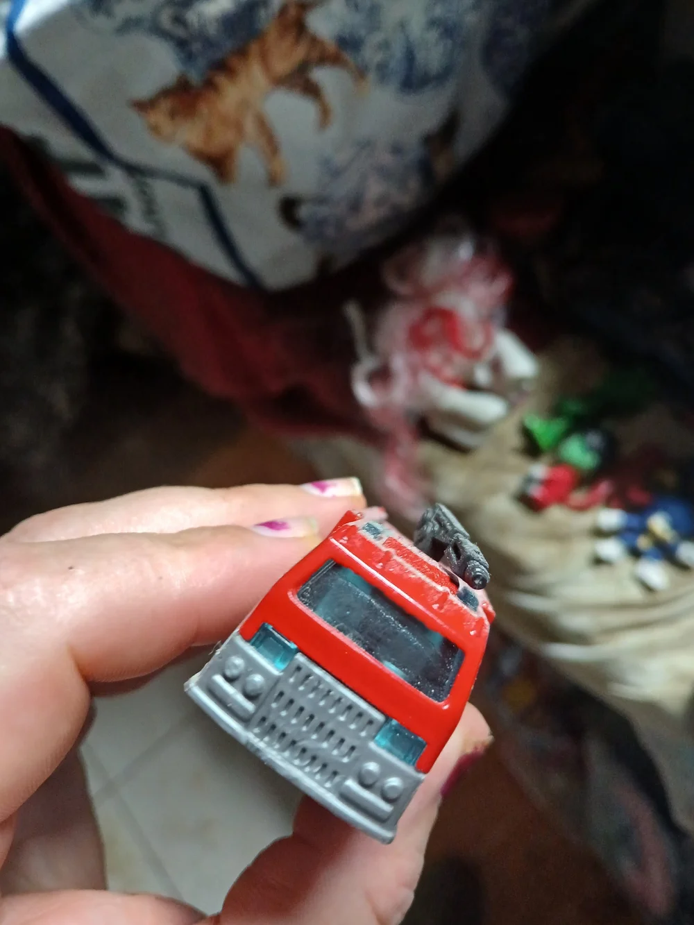 Matchbox Airport Fire Tanker toy vehicle, featuring a red body and a black water